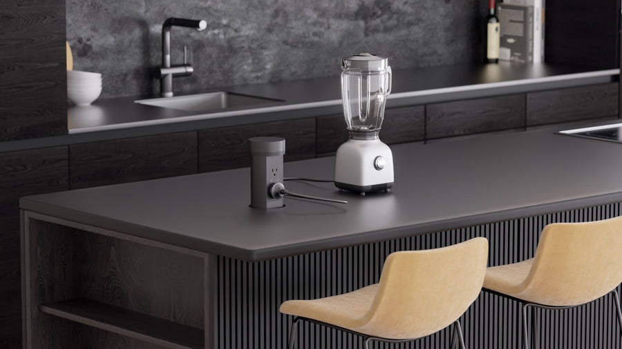 Black Point Pod powering a blender on a dark kitchen island