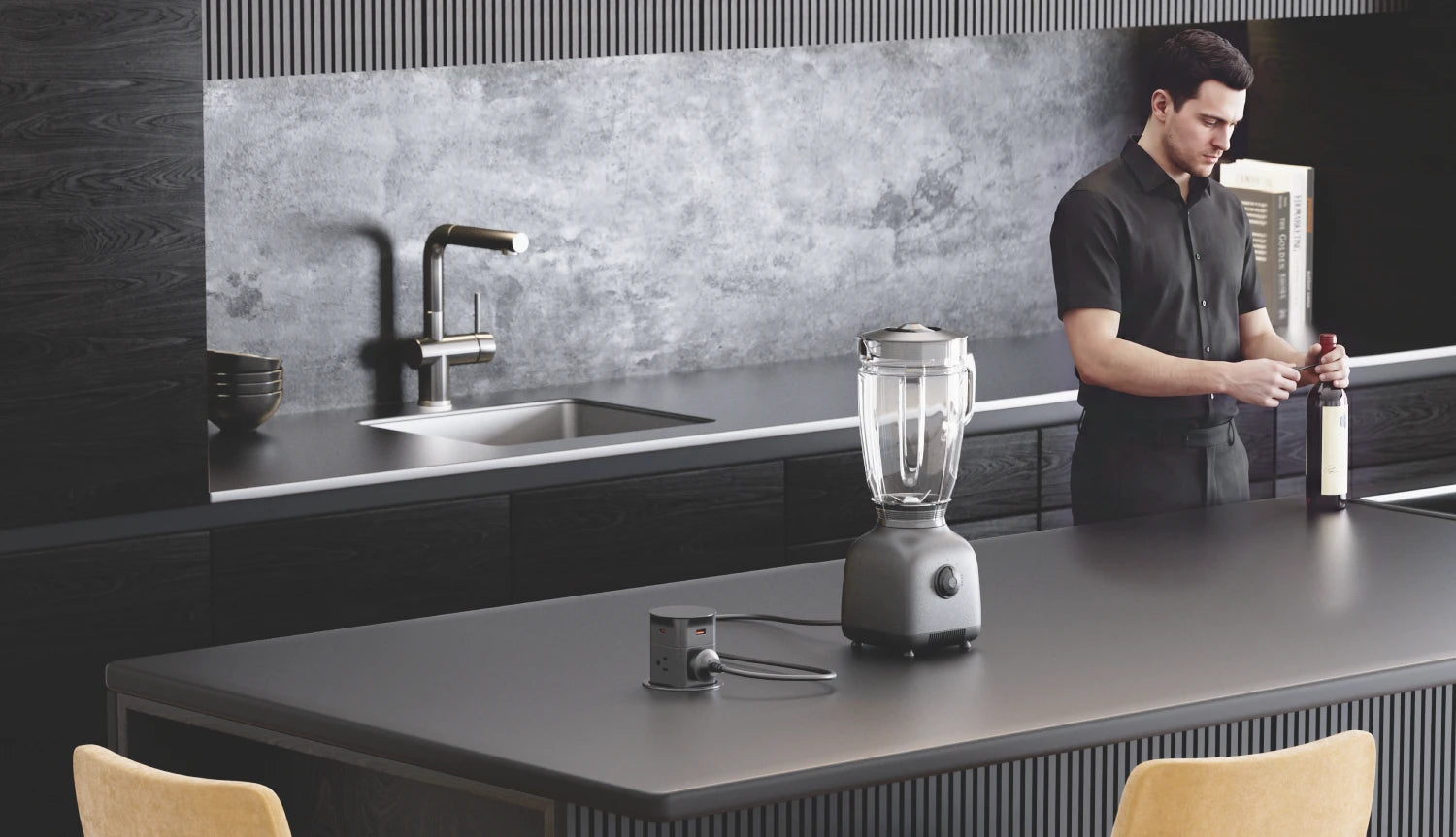 Person standing in a modern kitchen with a blender on the counter